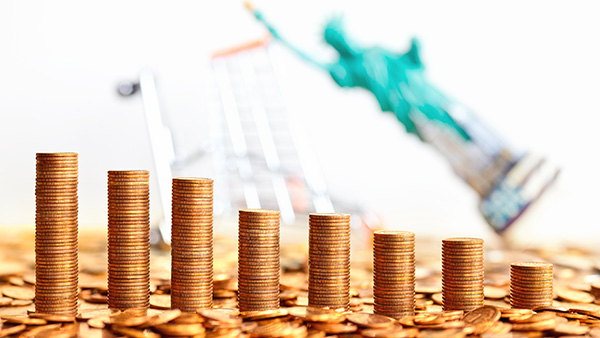 Image: Stacks of gold coins holding strong while the market collapses behind them.