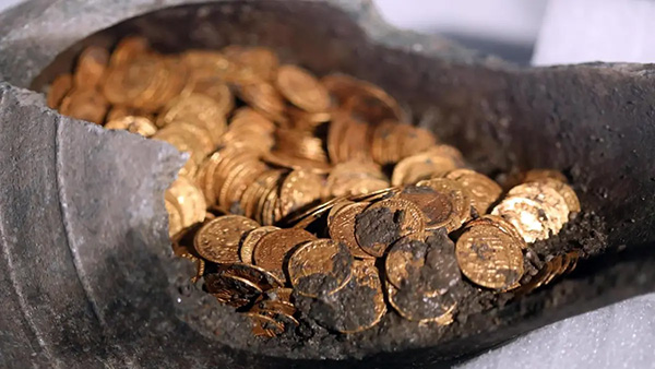 Image: A hoard of dirty gold coins.